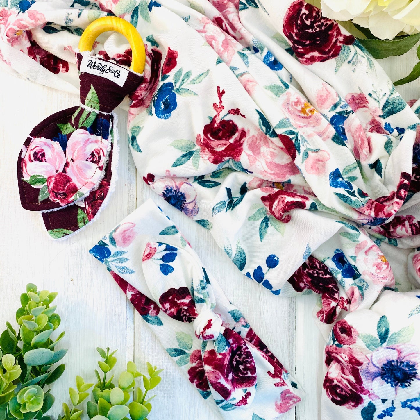 soft stretchy swaddle set with headband, baby teether in maroon roses print